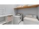Convenient laundry room with washer, dryer, and extra shelving at 12121 S 214Th Ave, Buckeye, AZ 85326