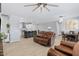 Relaxing living room with leather furniture and a view to the kitchen at 12121 S 214Th Ave, Buckeye, AZ 85326