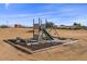 playground set in a large, sandy backyard at 12121 S 214Th Ave, Buckeye, AZ 85326