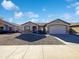 Single-story house with a two-car garage and desert landscaping at 1213 W Darrel Rd, Phoenix, AZ 85041