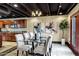 Glass dining table with six chairs in a well-lit area at 13610 S 41St Pl, Phoenix, AZ 85044