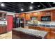 Spacious kitchen with dark wood cabinets and granite counters at 13610 S 41St Pl, Phoenix, AZ 85044