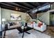 Living room with two sofas, a coffee table, and a loft staircase at 13610 S 41St Pl, Phoenix, AZ 85044