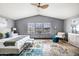 Bright main bedroom, featuring a ceiling fan and large windows at 13610 S 41St Pl, Phoenix, AZ 85044