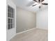 Bedroom with ceiling fan and large window at 14829 N 41St Pl, Phoenix, AZ 85032