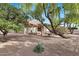 Landscaped backyard with mature trees and gravel ground cover at 15205 E Palomino Blvd, Fountain Hills, AZ 85268