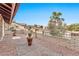 Landscaped front yard with brick wall and potted plants at 15205 E Palomino Blvd, Fountain Hills, AZ 85268