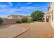 Large backyard with patio, artificial turf, and landscaping at 15663 W Sierra St, Surprise, AZ 85379