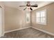 Bright bedroom with ceiling fan, carpet, and plantation shutters at 1646 S Martingale Rd, Gilbert, AZ 85295