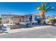 Front view of a manufactured home with covered parking and landscaping at 17200 W Bell Rd # 64, Surprise, AZ 85374