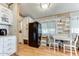 Kitchen with white cabinets, granite countertops, and black appliances at 17200 W Bell Rd # 64, Surprise, AZ 85374