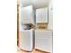 Stackable washer and dryer in a small laundry room with white cabinets at 17200 W Bell Rd # 64, Surprise, AZ 85374