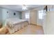 Spacious bedroom with queen bed, wood floors and en-suite bathroom at 17200 W Bell Rd # 64, Surprise, AZ 85374