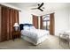 Comfortable bedroom with plush bedding and a private balcony at 19501 N 101St St, Scottsdale, AZ 85255