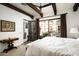 Spacious bedroom with king-size bed and access to a private patio at 19501 N 101St St, Scottsdale, AZ 85255