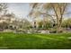 Luxury home exterior with manicured lawn at 19501 N 101St St, Scottsdale, AZ 85255