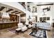 Gourmet kitchen with dark wood cabinetry, granite countertops and island at 19501 N 101St St, Scottsdale, AZ 85255