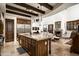 Open concept kitchen with island and breakfast bar at 19501 N 101St St, Scottsdale, AZ 85255