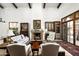 Bright living room with fireplace and view to the backyard at 19501 N 101St St, Scottsdale, AZ 85255