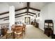 Spacious loft area with exposed beams and a cozy seating area at 19501 N 101St St, Scottsdale, AZ 85255