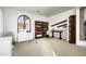 Well-lit home office featuring built-in shelving and workspaces at 19501 N 101St St, Scottsdale, AZ 85255