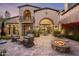 Spacious patio with fire pit and comfortable seating area at 19501 N 101St St, Scottsdale, AZ 85255