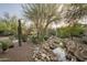Relaxing water feature with native plants at 19501 N 101St St, Scottsdale, AZ 85255