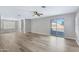 Spacious living room with light wood flooring and sliding glass doors at 3124 W Pollack St, Phoenix, AZ 85041