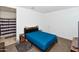Bedroom with blue bedding and ensuite bathroom at 3372 W Stanton Ave, Apache Junction, AZ 85120