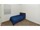 Small bedroom with blue bedding and window at 3372 W Stanton Ave, Apache Junction, AZ 85120