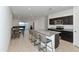 Open kitchen features granite island and dark cabinetry at 3372 W Stanton Ave, Apache Junction, AZ 85120