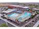 Community pool and recreation area with water slides and lounge chairs at 35980 W San Ildefanso Ave, Maricopa, AZ 85138