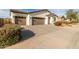 Single-story home with two-car garage and landscaped front yard at 3908 S 78Th Ln, Phoenix, AZ 85043