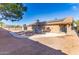 Spacious backyard with gravel landscaping, solar panels, and storage shed at 3953 W Evans Dr, Phoenix, AZ 85053