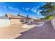 Backyard view showing gravel, a storage shed, and solar panels at 3953 W Evans Dr, Phoenix, AZ 85053