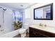 Clean bathroom with tub, shower, toilet, and vanity at 3953 W Evans Dr, Phoenix, AZ 85053