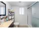 Clean bathroom with shower, vanity, and linen storage at 3953 W Evans Dr, Phoenix, AZ 85053