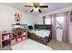 bedroom with twin bed, shelving, and playful decor at 3953 W Evans Dr, Phoenix, AZ 85053