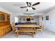 Open dining room with a rustic table and view into living room at 3953 W Evans Dr, Phoenix, AZ 85053