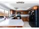 L-shaped kitchen with ample counter space and wood cabinets at 3953 W Evans Dr, Phoenix, AZ 85053