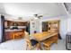 Bright kitchen with ample cabinetry, island, and adjacent dining area with wood table at 3953 W Evans Dr, Phoenix, AZ 85053