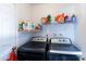 Laundry room with side-by-side washer and dryer, and shelving at 3953 W Evans Dr, Phoenix, AZ 85053