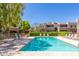 Inviting community pool with lounge chairs at 4444 E Paradise Village N Pkwy # 166, Phoenix, AZ 85032