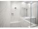 Modern bathroom with white marble tile and double vanity at 4923 E Village Dr, Scottsdale, AZ 85254
