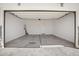 Attached garage with an open door and concrete floor at 4923 E Village Dr, Scottsdale, AZ 85254