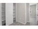 Neat storage closet with shelving and a door at 4923 E Village Dr, Scottsdale, AZ 85254