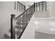 Modern metal staircase with carpeted steps at 4923 E Village Dr, Scottsdale, AZ 85254