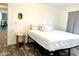 Cozy bedroom with wood-look floors and nightstand at 701 S Dobson Rd # 158, Mesa, AZ 85202