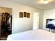 Bright bedroom with large closet and mounted TV at 701 S Dobson Rd # 158, Mesa, AZ 85202