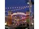 Evening view of Mesa Riverview entrance with lights at 701 S Dobson Rd # 158, Mesa, AZ 85202